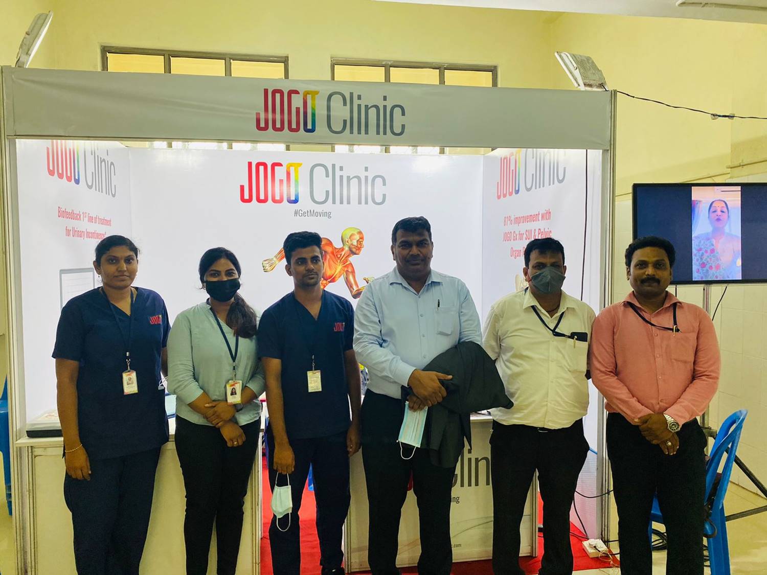 Group of JOGO staff in front of a stall.
