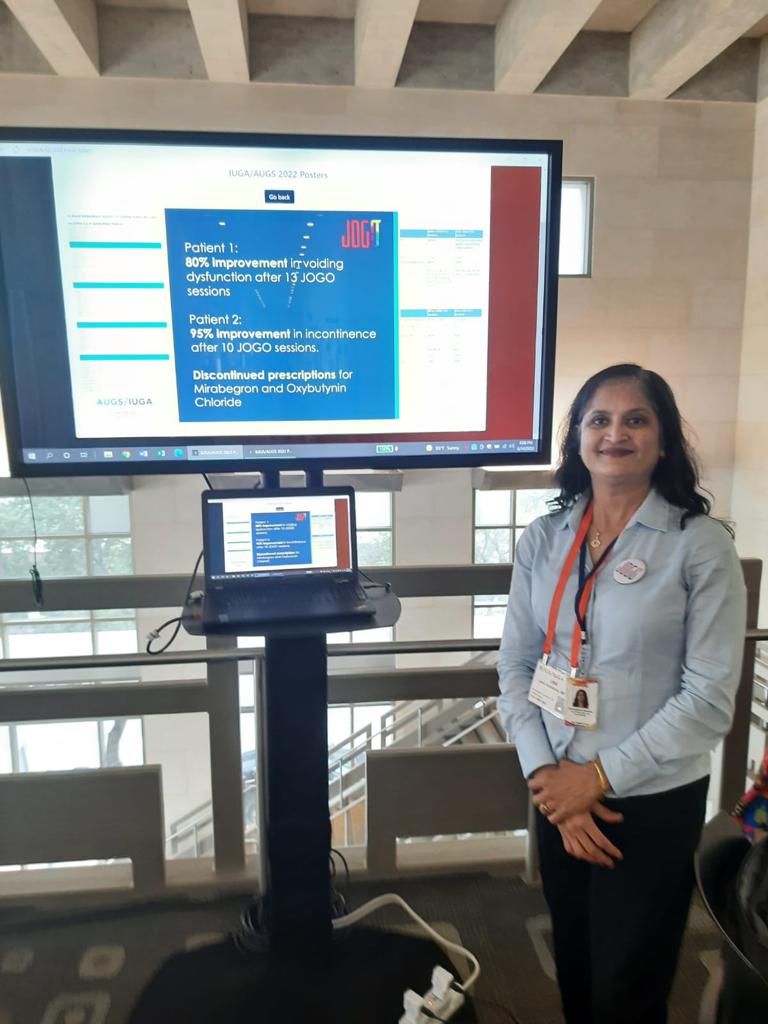 JOGO staff with a presentation at a conference.