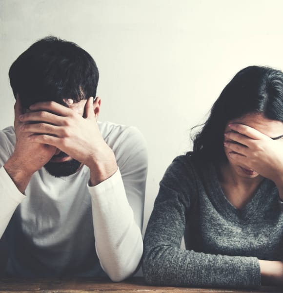 Unhappy couple concerned about sexual dysfunction.